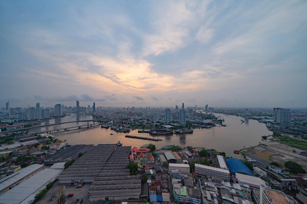 High angle view of buildings against cloudy sky