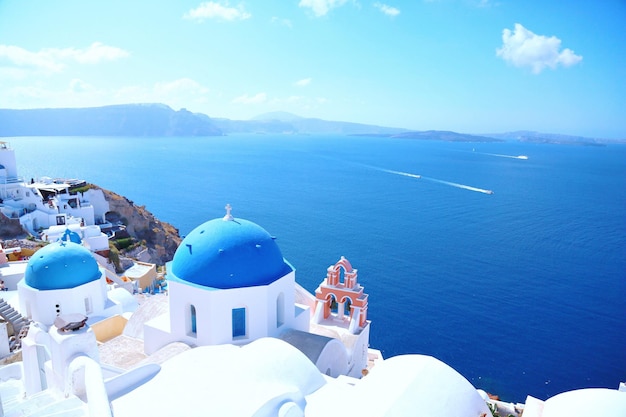 high angle view of buildings by sea against sky