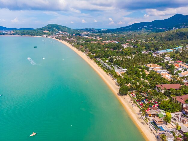 High angle view of buildings by sea against sky