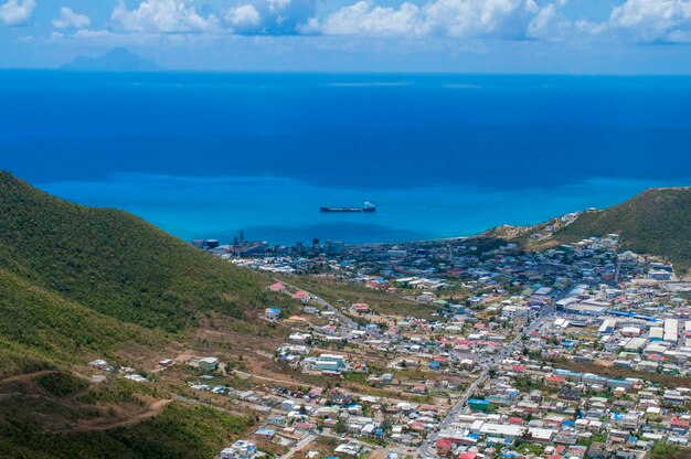 High angle view of buildings by sea against sky