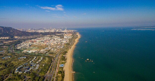 High angle view of buildings by sea against sky