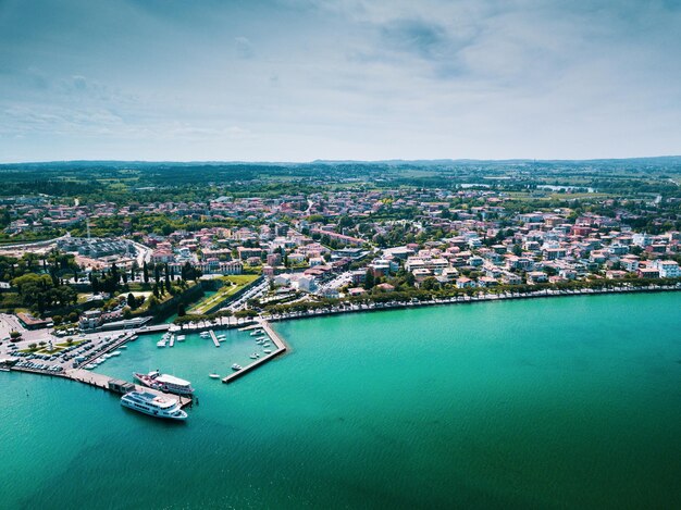 High angle view of buildings by sea against sky