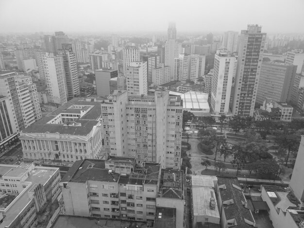 High angle view of buildings in city against sky