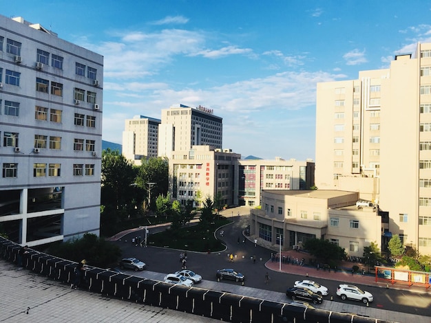 High angle view of buildings in city against sky