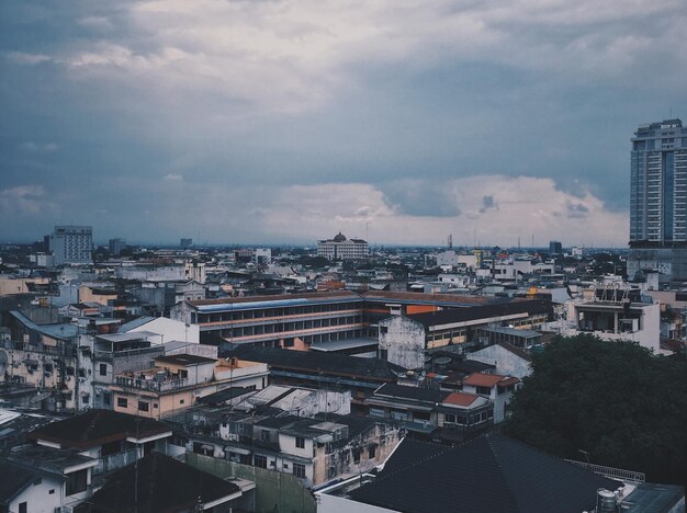 High angle view of buildings in city against sky