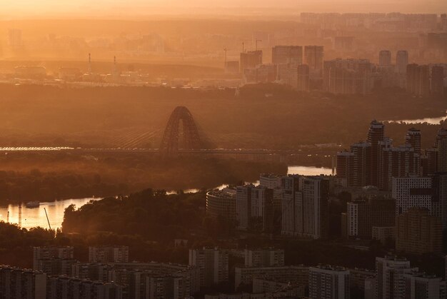 High angle view of buildings in city during sunset