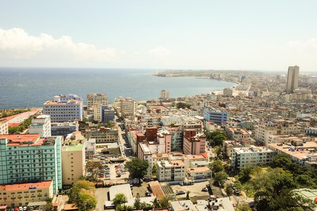 High angle view of buildings and sea against sky