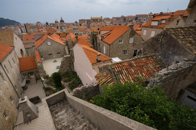 High angle view of buildings in town against sky