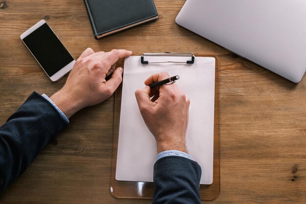 High angle view of business colleagues working on table