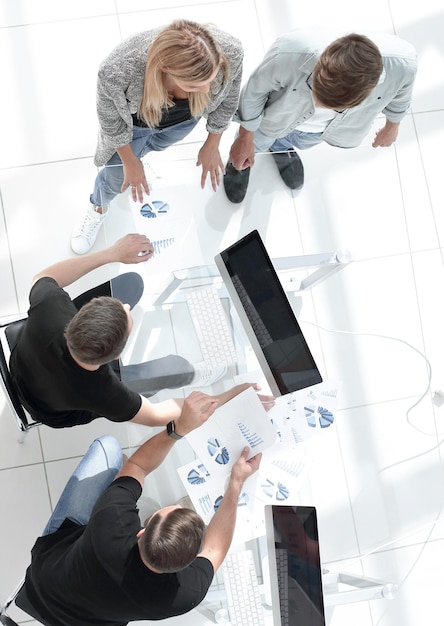 High angle view of businessmen discussing at table in office