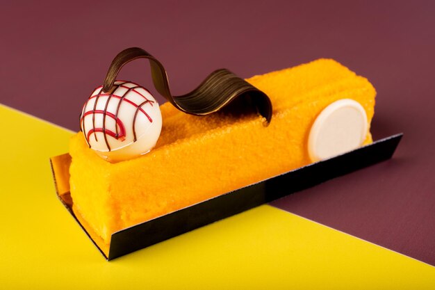 High angle view of cake on table against yellow background