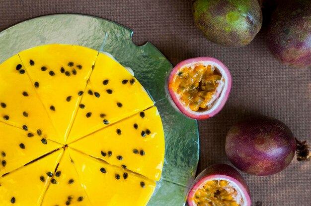 High angle view of cake with passion fruits on table