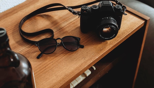 high angle view of camera and sunglasses