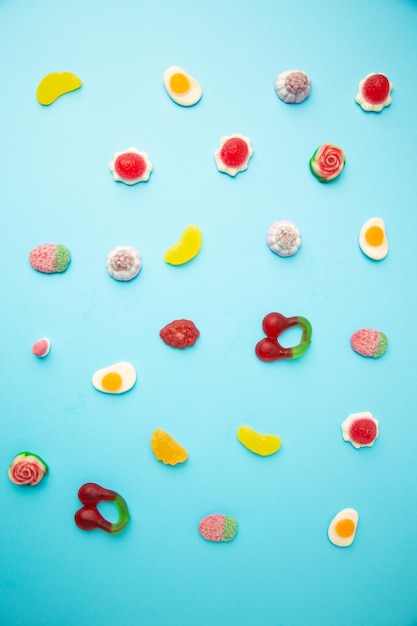 High angle view of candies against blue background