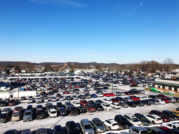 High angle view of cars in parking lot against clear sky