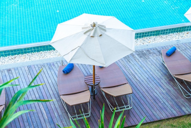 High angle view of chairs in swimming pool