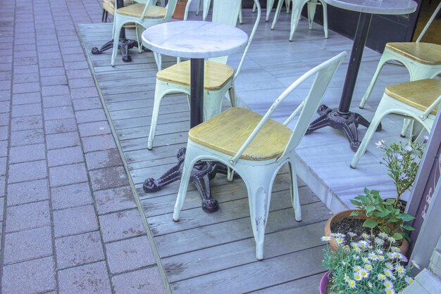 High angle view of chairs and table at sidewalk cafe