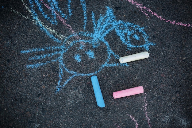 Photo high angle view of chalks by drawing on road