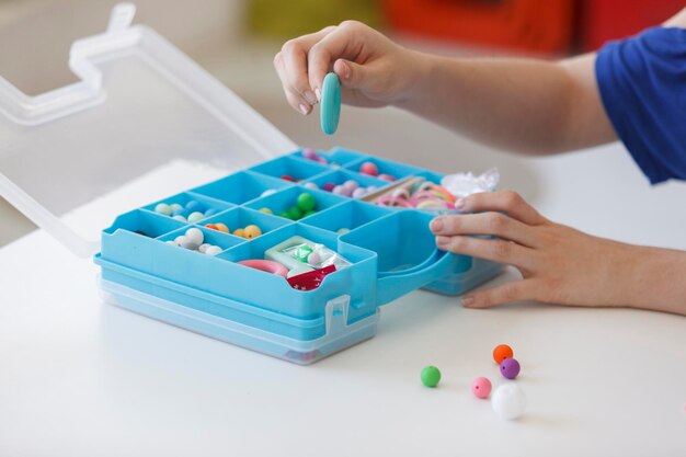 High angle view of child playing with multi colored table