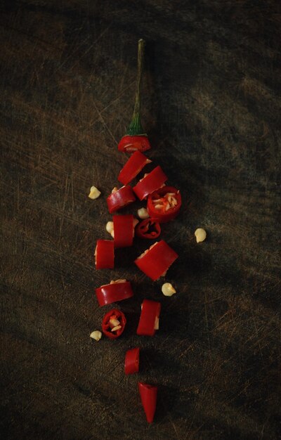 High angle view of chopped red chili pepper on the rustic board