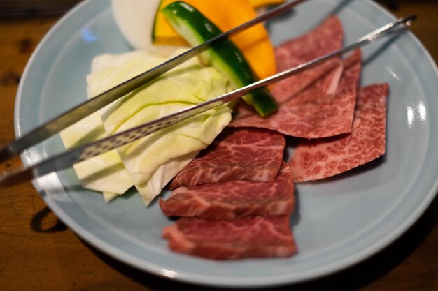 High angle view of chopped vegetables in plate on table