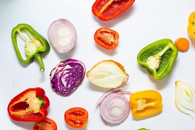 Photo high angle view of chopped vegetables on white background