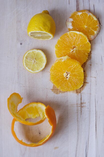 High angle view of citrus fruit slices on wooden table