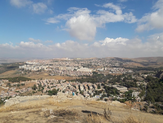 High angle view of city against cloudy sky