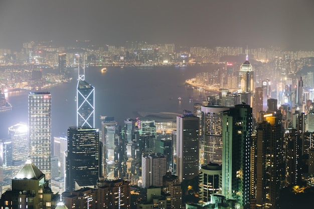 Photo high angle view of city by river at night