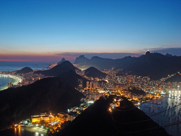 Photo high angle view of city lit up at night