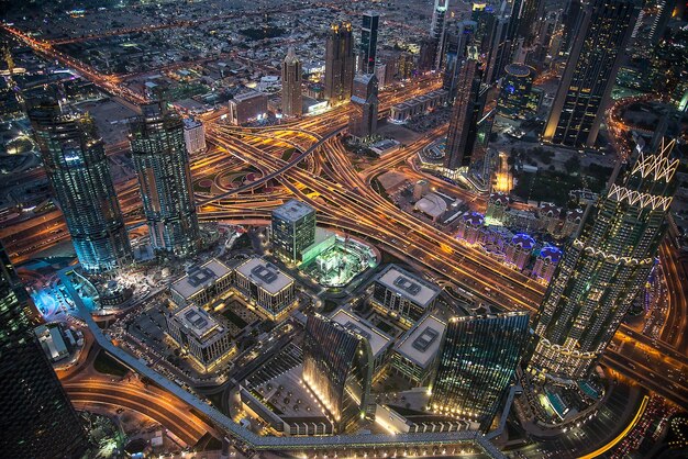 High angle view of city lit up at night