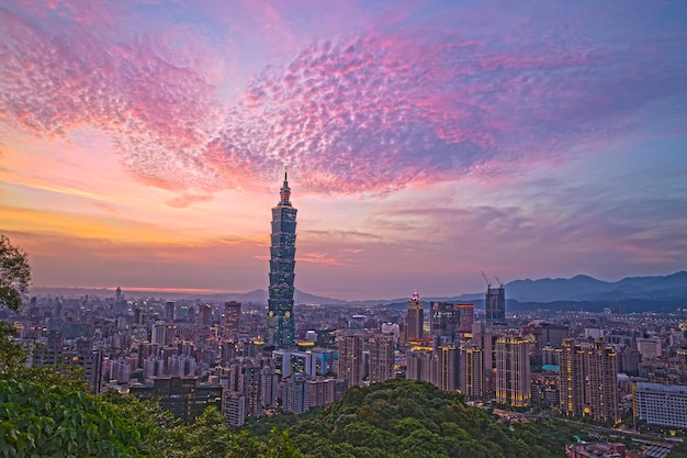 high angle view of city lit up at sunset