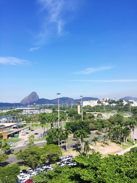 High angle view of cityscape against blue sky