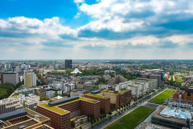 High angle view of cityscape against cloudy sky