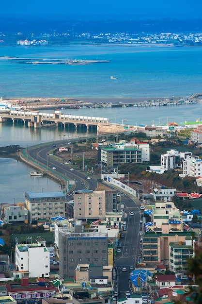 High angle view of cityscape by sea