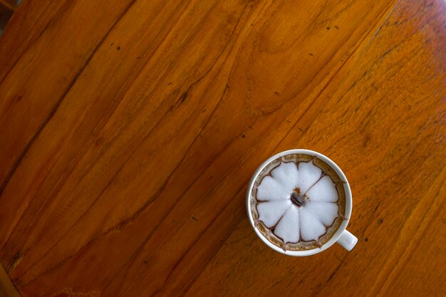 High angle view of clock on wooden table