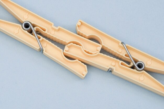 High angle view of clothespins on white background