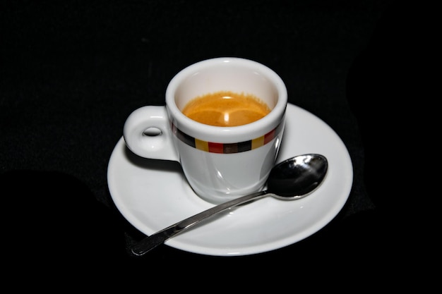 High angle view of coffee cup against black background