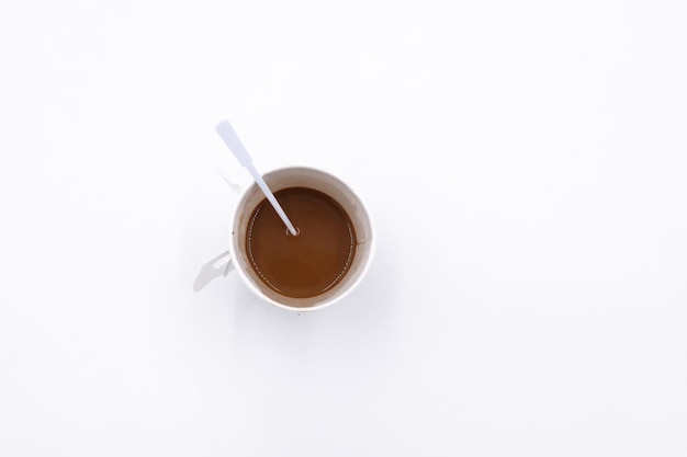 High angle view of coffee cup against white background