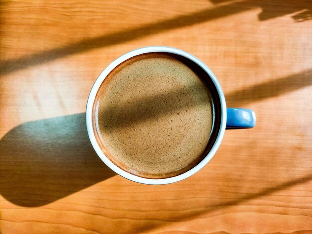 High angle view of coffee cup on table