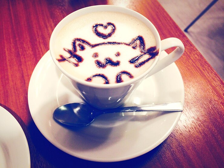 Photo high angle view of coffee in cup on wooden table
