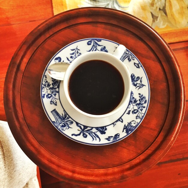 High angle view of coffee on plate at table