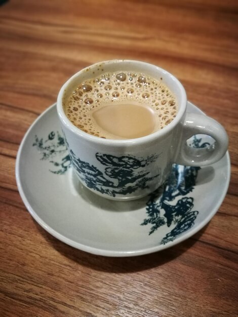 Photo high angle view of coffee on table