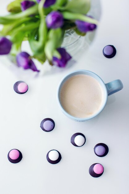 High angle view of coffee with sweet food on table