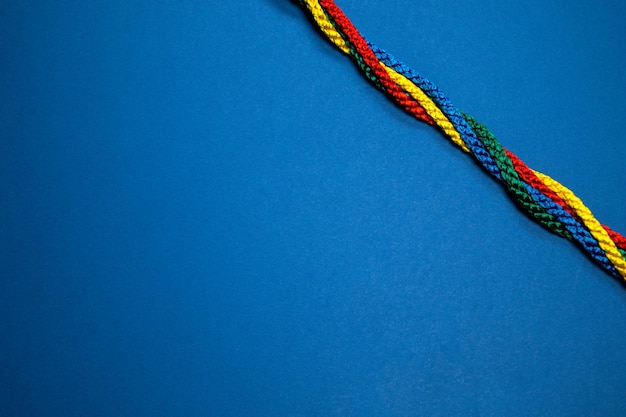 Photo high angle view of colored pencils against blue background