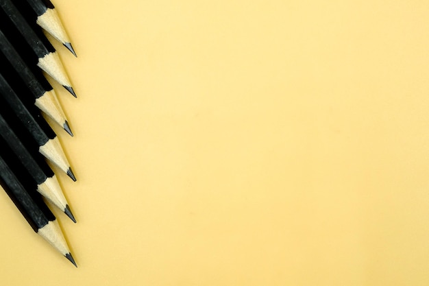 High angle view of colored pencils against white background