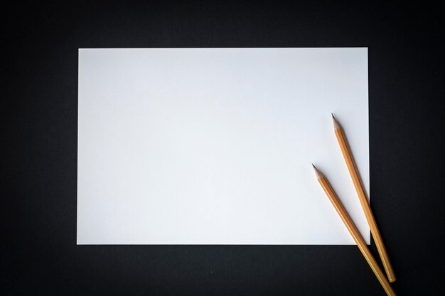 Photo high angle view of colored pencils on table against black background