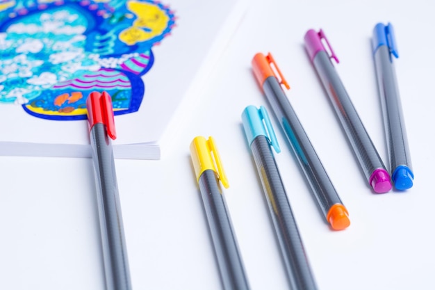 High angle view of colored pencils on white table