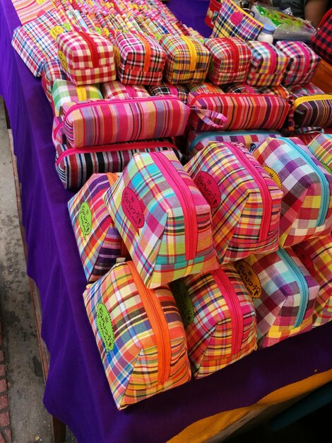 High angle view of colorful bags for sale at market stall