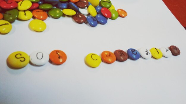 High angle view of colorful balls on white background